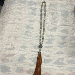Elegant Beaded Necklace with Orange Tassel
